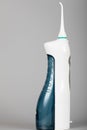 Cordless water flosser with jet tip. Royalty Free Stock Photo