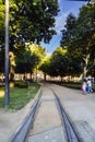 Cordoaria`s Garden with tram tracks crossing it and people strolling in the center of Porto, Royalty Free Stock Photo