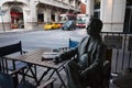 Sculpture of Daniel Salzano drinking coffee near Bar Sorocabana