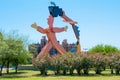 Argentina Cordoba flowerbed and urban man sculpture