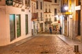 Cordoba, Spain - April 11, 2023: Tourists along the city streets at night Royalty Free Stock Photo