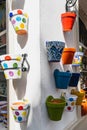 Cordoba, Spain, March 7, 2022. Colorful potsherds on a white facade in the city of Cordoba,. Spain Royalty Free Stock Photo
