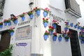 CORDOBA, SPAIN - 5 MAY, 2017: Flowers in flowerpot on the white walls on famous Flower street Calleja de las Flores in old Jewish