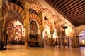 Artworks with religious motif and tall columns of the moorish Mezquita, Mosque-Cathedral