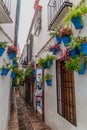 CORDOBA, SPAIN - NOVEMBER 4, 2017: Narrow street Calleja de las Flores in Cordoba, Spa