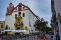 Cordoba, Spain - September 02, 2015: Open restaurant with umbrella serving mostly tourists in city center before religious