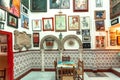 Tapas bar interior with vintage posters, paintings, flamenco musicians portraits and traditional andalucian symbols