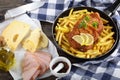 Cordon Bleu and french fries in skillet