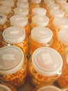 Cordyceps militaris in glass bottles at herbal farm within light and temperature control room. Chinese medicine . Chinese herb .