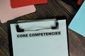 Core Competencies write on a paperwork isolated on Wooden Table Royalty Free Stock Photo