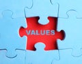 Core values concept. Light blue puzzle with missing piece on red background Royalty Free Stock Photo