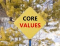 Core values symbol. Concept words Core values on beautiful yellow road sign. Beautiful forest snow blue sky background. Business Royalty Free Stock Photo