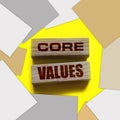 core values words on wooden blocks on yellow background. Business ethics concept