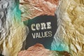 Core Values written behind torn foil paper. Business ethics concept