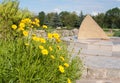 Coreopsis flowers and Sunny clock, Salgirka park, Simferopol, Crimea