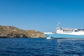 Marmari Express big blue ferry ship enterning port in Coressia on Kea Island, Cyclades, Greece in the morning on sunny day. Royalty Free Stock Photo