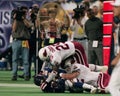 Corey Chavous and Zack Walz tackle Cris Carter