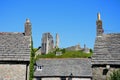 Corfe castle and cottage rooftops. Royalty Free Stock Photo