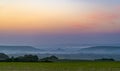 Corfe Castle sunset with mist rolling in