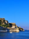 Corflu island castle, liight and church of st george by the sea , greece Royalty Free Stock Photo
