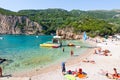 CORFU-AUGUST 26: Palaiokastritsa beach, holidaymakers sunbathe on the beach on August 26,2014 on the Corfu island, Greece.