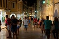 CORFU-AUGUST 25: Tourists walk on night Kerkyra on August 25, 2014 in Kerkyra town on the Corfu island, Greece. Royalty Free Stock Photo