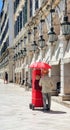 corfu city barrel organ red on the street in summer noon greeece