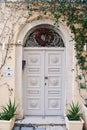 Corfu, Greece - 10.07.2021: Beautiful white old door Royalty Free Stock Photo