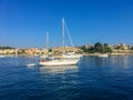 Corfu, Greece - July 7, 2018: Beautiful view of the city of Kerkyra and sailing yachts in the Greek bay against the blue sky Royalty Free Stock Photo