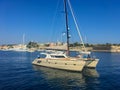 Corfu, Greece - July 7, 2018: Beautiful view of the city of Kerkyra and sailing yachts in the Greek bay against the blue sky. Royalty Free Stock Photo