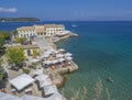 Corfu, Greece - June 7, 2017: Faliraki beach Alecos Baths public bathing spot with the En plo restaurant in Corfu Town, turquoise