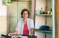 A woman owner of a traditional greek vintage Bakery at the city center of Corfu, Greece