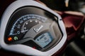 Corfu, Greece - September 2021. Dashboard of modern motor bike or scooter Vespa in red color. Close-up view. Moped