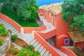 CORFU ISLAND, GREECE, JUNE 03, 2014: Cascade red dark rose white colors hotel. Greek open stone diagonal stair staircase. Cascade Royalty Free Stock Photo