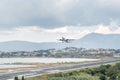 Corfu island, Greece. Modern passenger airplane landing at international airport. Royalty Free Stock Photo