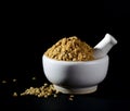 Coriander Powder and seeds with mortar and pestle on black background Royalty Free Stock Photo