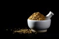 Coriander Powder and seeds with mortar and pestle on black background Royalty Free Stock Photo