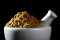 Coriander Powder and seeds with mortar and pestle on black background Royalty Free Stock Photo