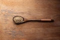 Coriander seed, spices, in wooden spoon on rustic wood table background Royalty Free Stock Photo