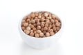 Coriander Seeds in a bowl on white background. Royalty Free Stock Photo