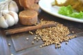 Coriander seeds and cinnamon on a wooden table, Indonesian spices Royalty Free Stock Photo