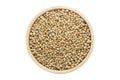 Coriander seeds in wooden bowl isolated top view on white