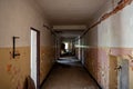 Coridor and flaking paint at abandoned derelict old building. Empty corridor in an abandoned building. Indoor interior of run down Royalty Free Stock Photo