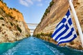 Corinth channel in Greece and greek flag on ship Royalty Free Stock Photo