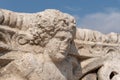 Corinthian capital bearing the carved head of Dionysus at Beit She`an in Israel