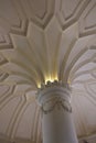 Corinthian capital and decorated ceiling