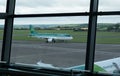 Cork airport terminal with air lingus airplane on the departure runway