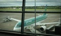 Cork airport terminal with air lingus airplane on the departure runway