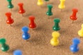 Cork board with lot a colorful pins. Royalty Free Stock Photo