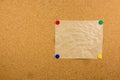 Cork board with sticky note pinned Royalty Free Stock Photo